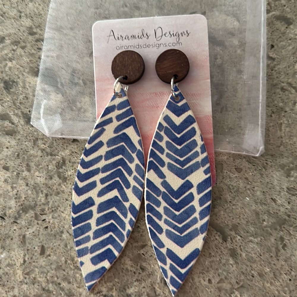 New in pouch handmade leather earrings